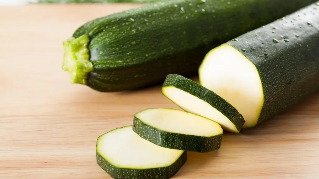 air fryer courgettes on a wooden chopping board