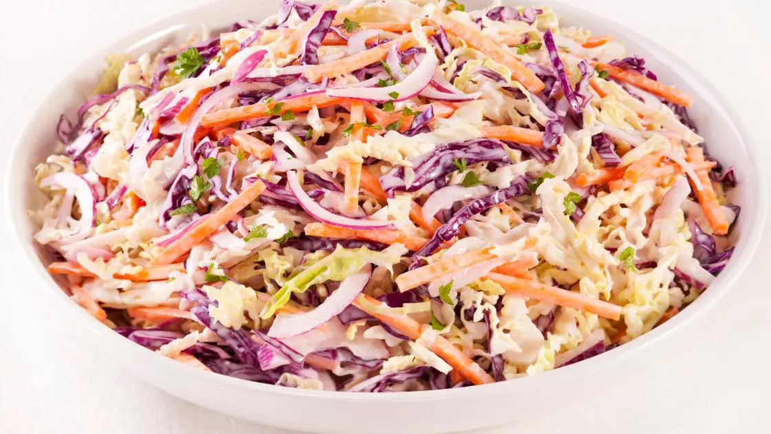 Crunchy Coleslaw In A White Bowl